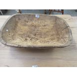 A small rustic wood bowl/ trough
