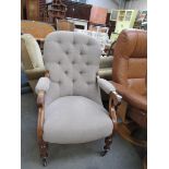 A Victorian mahogany buttonback armchair on turned supports to castors,