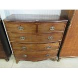 An early Victorian mahogany two over three bow fronted chest of drawers,