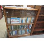 A retro 1960s glazed front bookcase and books