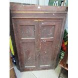 A Georgian twin panelled door corner cabinet,