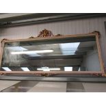 A 1930s carved and gilt framed mirror,