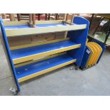 A double sided library bookcase and a storage rack