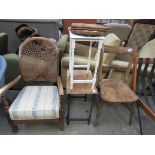 A 1920s cane back armchair, a knife-back kitchen chair,