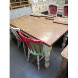 A Victorian style pine kitchen table on painted turned legs 92 x 121cm