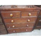A Victorian mahogany two over three chest of drawers