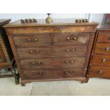 A George III flame mahogany chest of two short over four long drawers on ogee bracket feet,