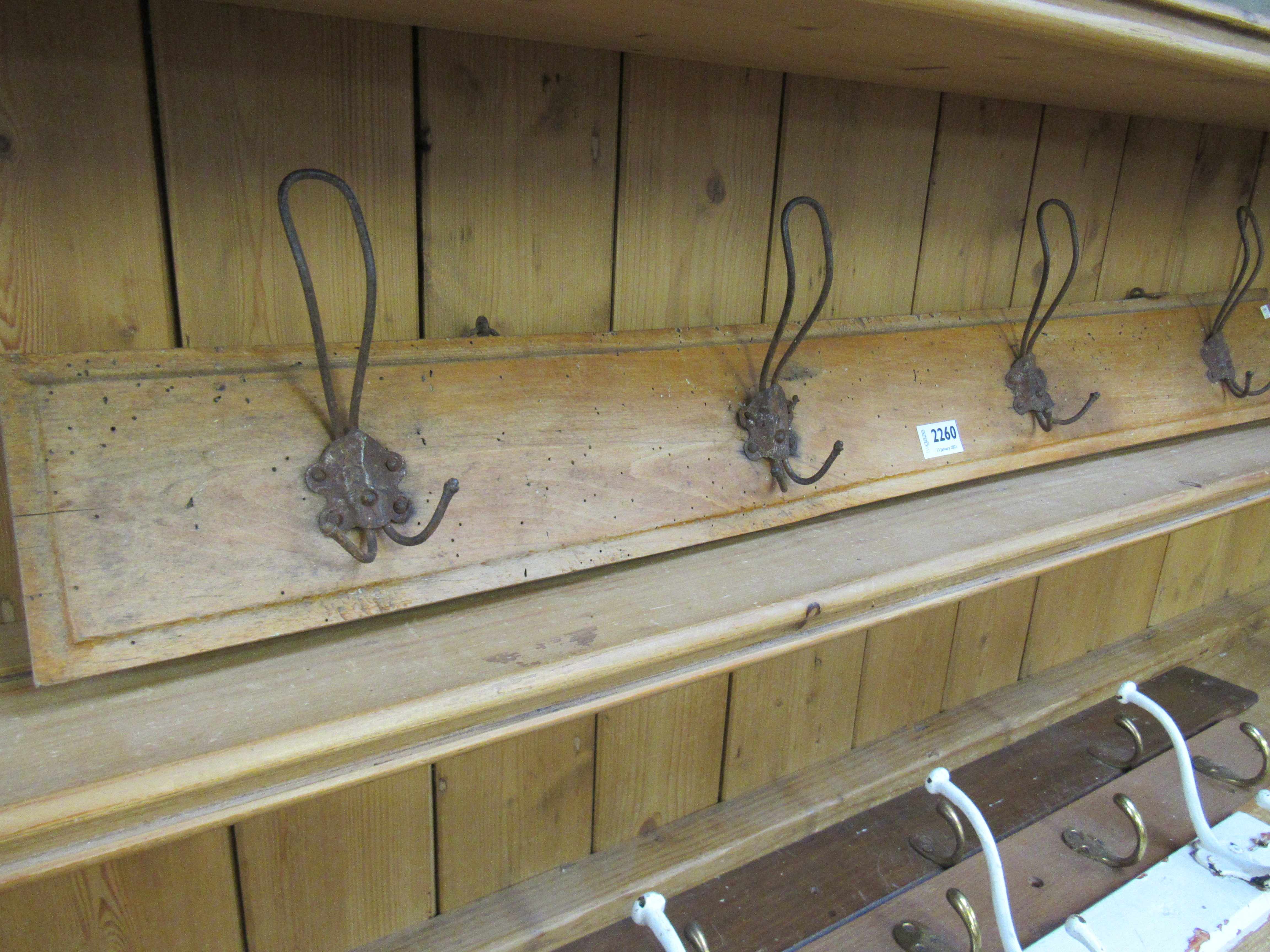 Four wire coat hooks on timber rail