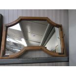 A country pine framed wall mirror with metal bracket decoration