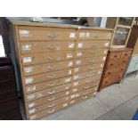 A 1950s beech chest of 20 drawers,