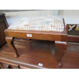 An Edwardian mahogany footstool with drop-in seat,