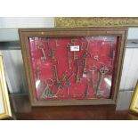 A wall hanging display case of assorted 18th and 19th iron keys