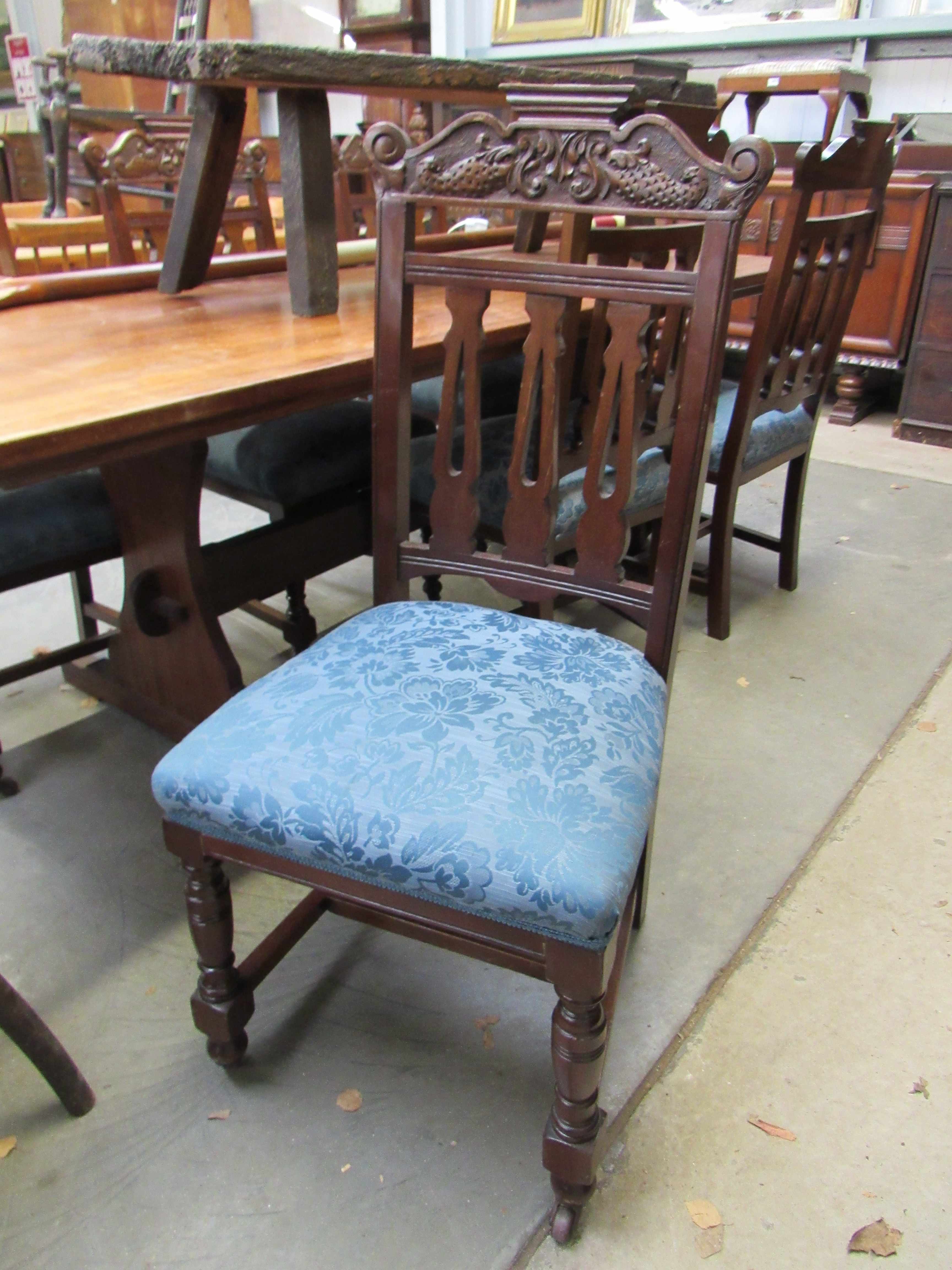 Six late Victorian mahogany dining chairs with dolphin carved backs