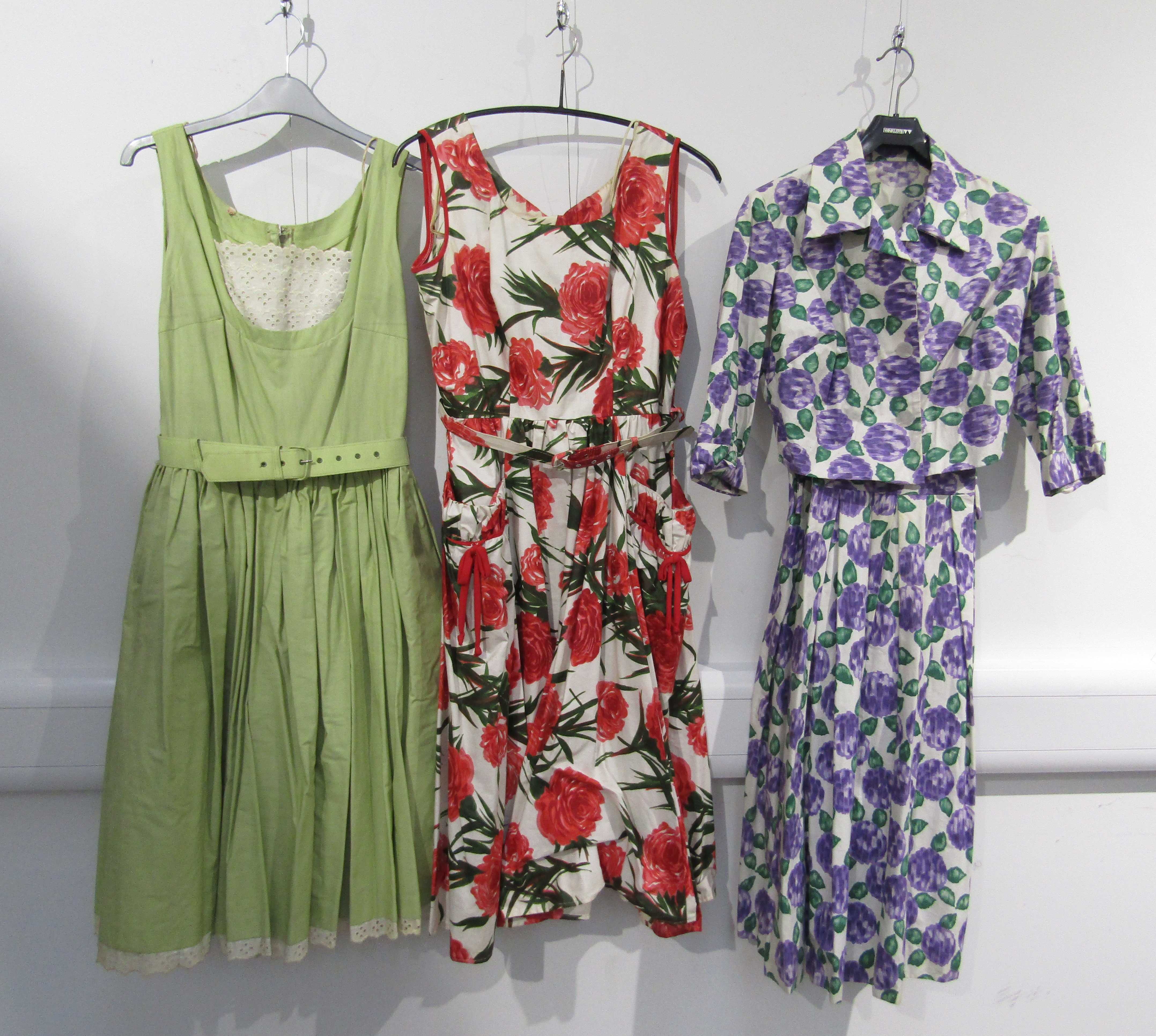 Two 1950's day dresses and a lilac and green fruit pattern dress jacket ensemble