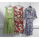 Two 1950's day dresses and a lilac and green fruit pattern dress jacket ensemble
