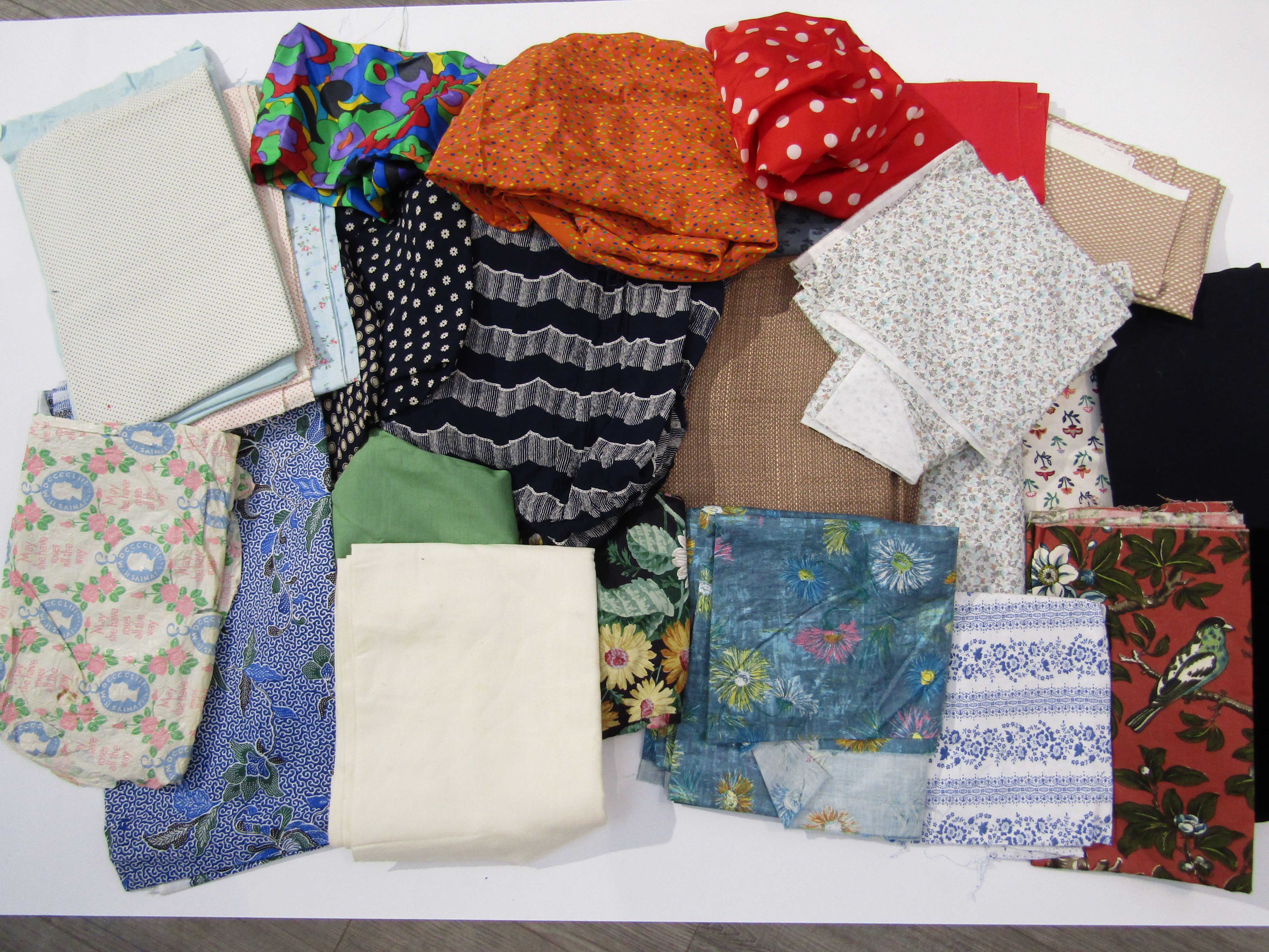 A quantity of dress making fabric remnants, various designs and periods including cottons,