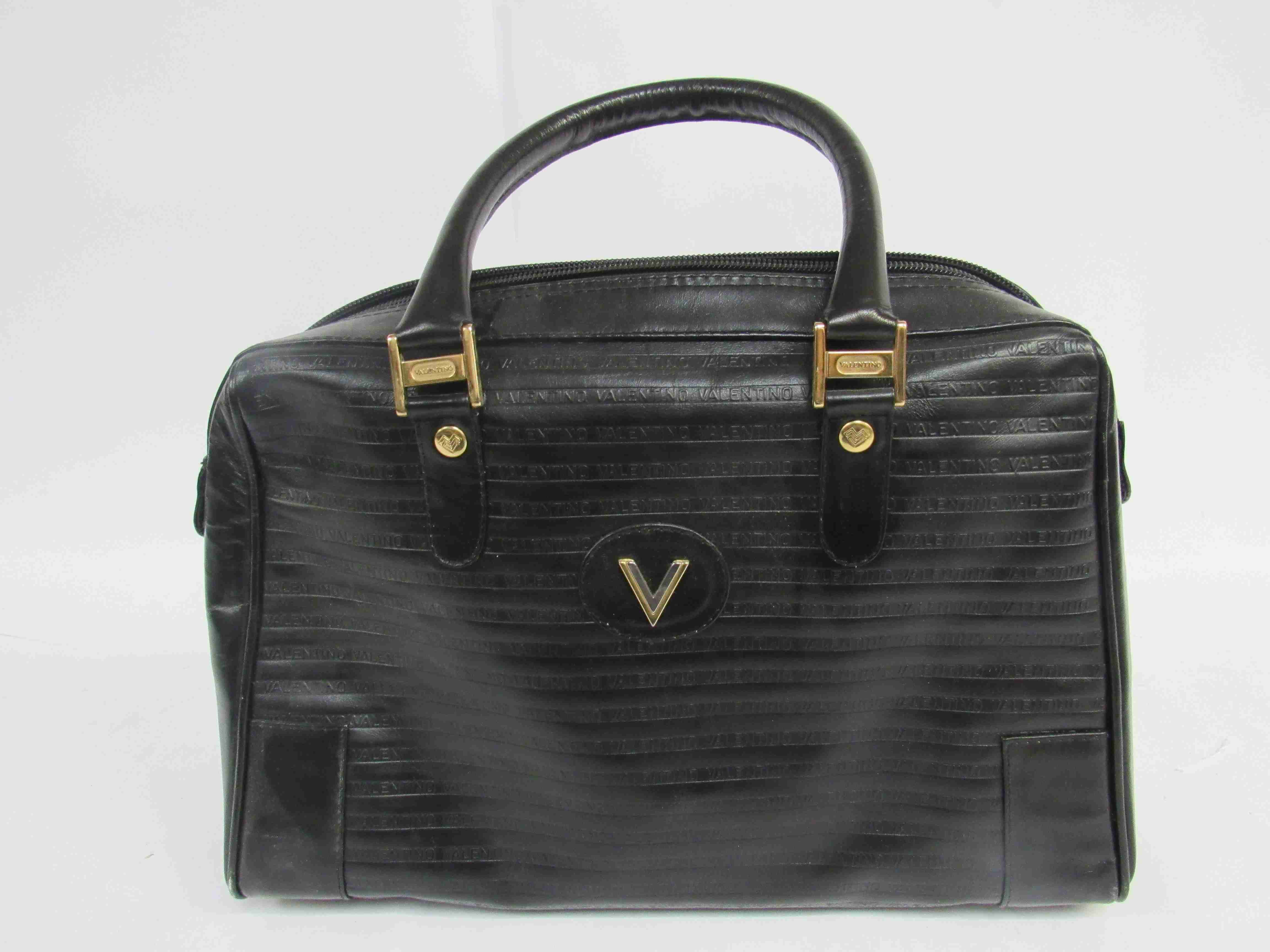 VALENTINO black leather soft body handbag.