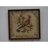 A Victorian tapestry depicting a bird in naturalistic setting,