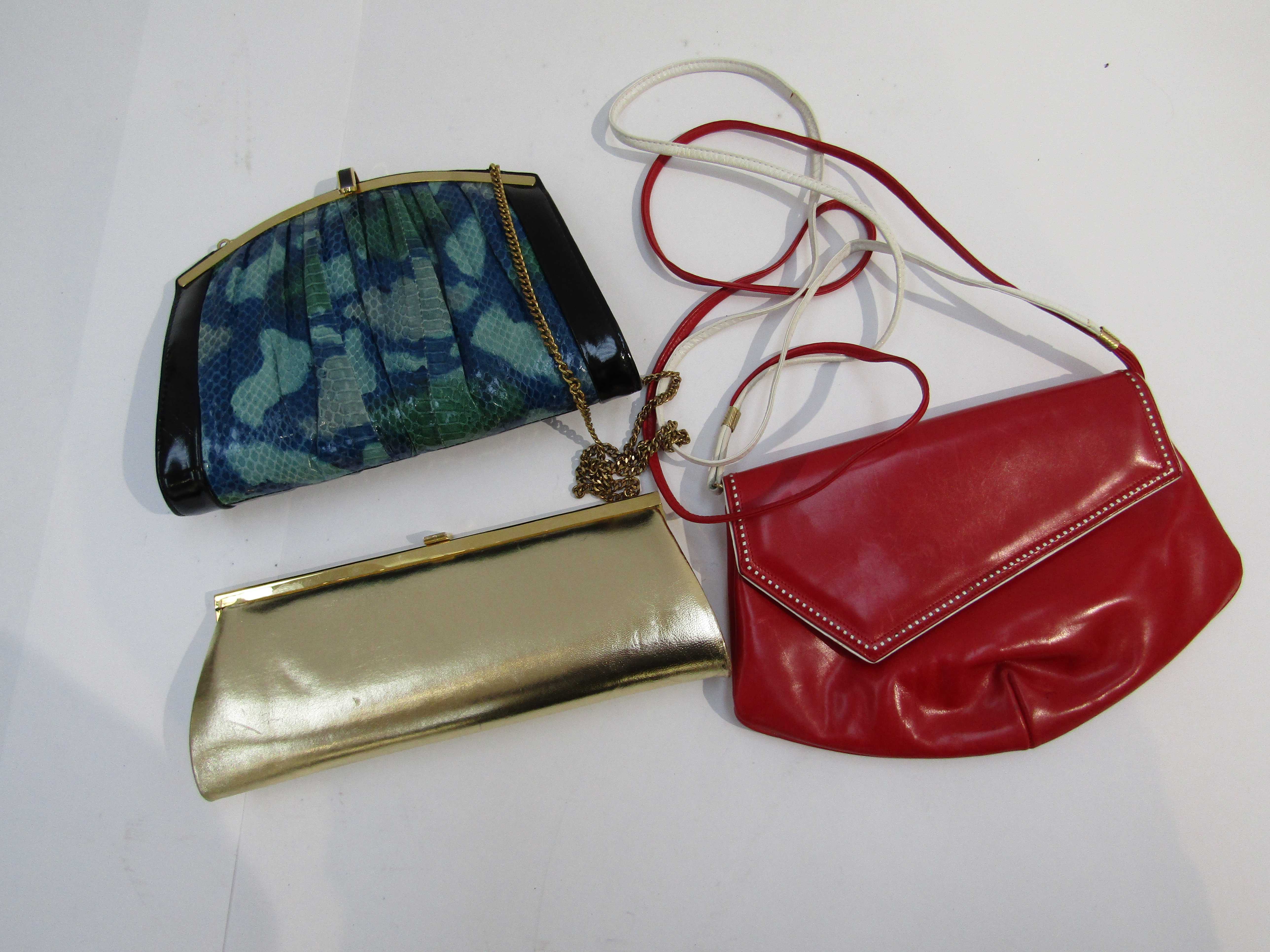 A Kurt Geiger red and white leather shoulder bag, with another,