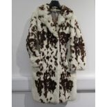 A 1960's white fur coat with a brown mottled spot pattern,