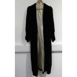 An early 20th Century black velvet coat, soft ruching at sleeve,