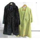 A 1960's grey faux fur coat with a large bobble button cross over fastening and a 1950's pale green