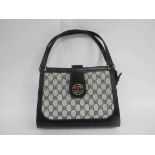 GUCCI BREVETTATO GG vintage monogram double handle handbag.