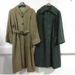 A dark green wool coat with a large collar, turn back cuffs, seamed yolk,