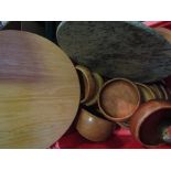 A box of treen including teak bowls,