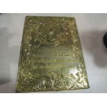 An embossed brass tin wall plaque with Robert Burns design