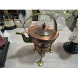 An Art Nouveau copper kettle on stand,