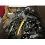 A box of plated flatware