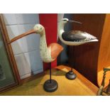 Two wooden figures of sea birds on pedestal stands