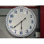 An enamelled oversized wall clock,