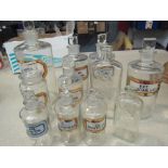 Nine assorted apothecary bottles with lids and original labels and two old Boots bottles