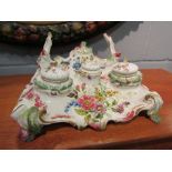 A 19th Century Continental porcelain ink and pen stand with all over floral detail,