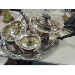 A silver plated three piece tea set with tray