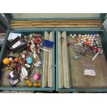 A leather jewellery box with mixed contents