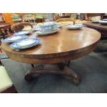 A Regency mahogany centre table, circular top over faceted column to trefoil scrolled base,