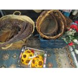 Two boxes of mixed items including wicker baskets, faux flowers,