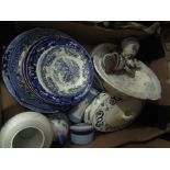A box of assorted blue and white ceramics