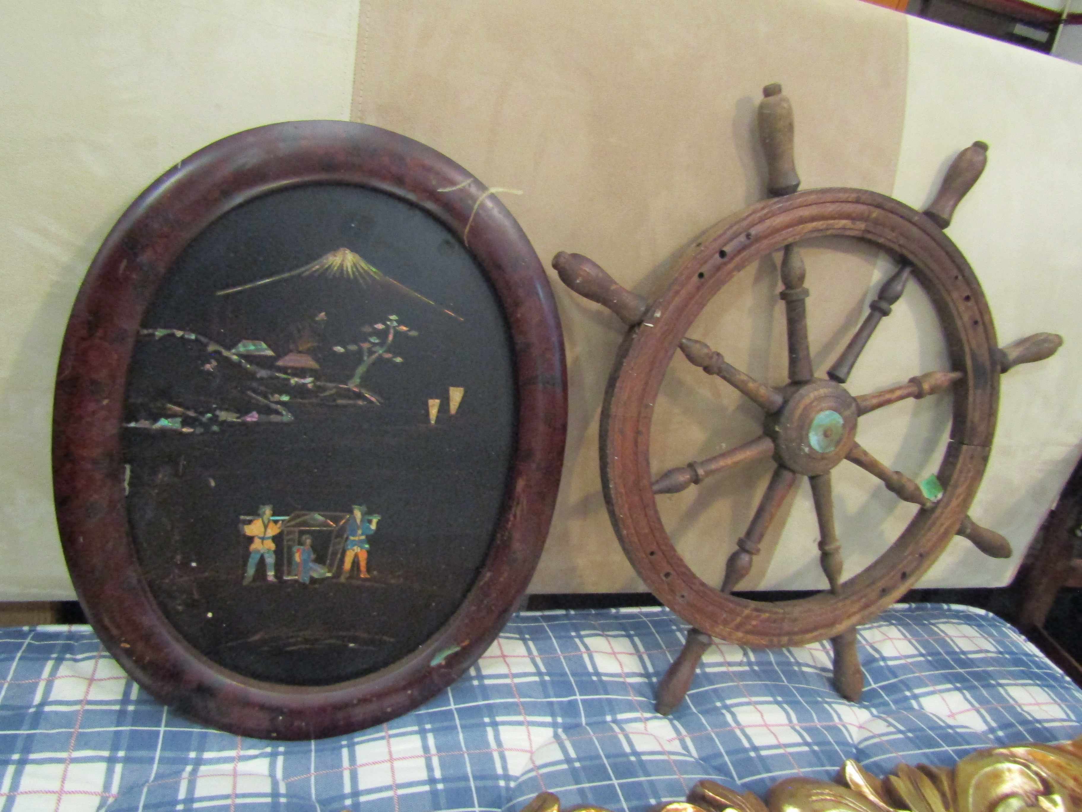 An Oriental plaque and a ship's wheel (2)