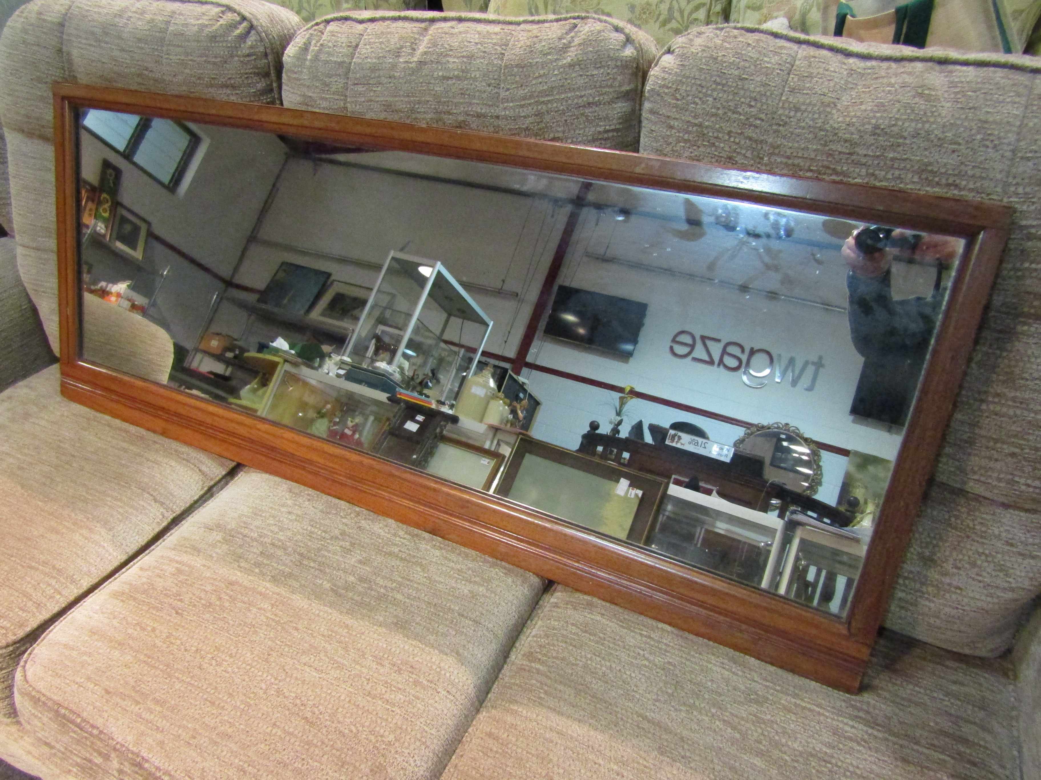 An oak overmantel mirror,