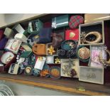 A display case of mixed costume jewellery