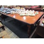 A Circa 1900 mahogany extending dining table with two extra leaves and winding handle,