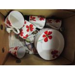 A box containing a white ground part dinner service with red floral design