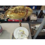 A brass pedestal table,