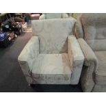 A modern upholstered tub armchair