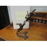 A pair of limited edition solid bronze boxing hares, boxed with certificate, 122/250,