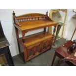 A Victorian walnut two tier serving table/buffet with raised gallery back,